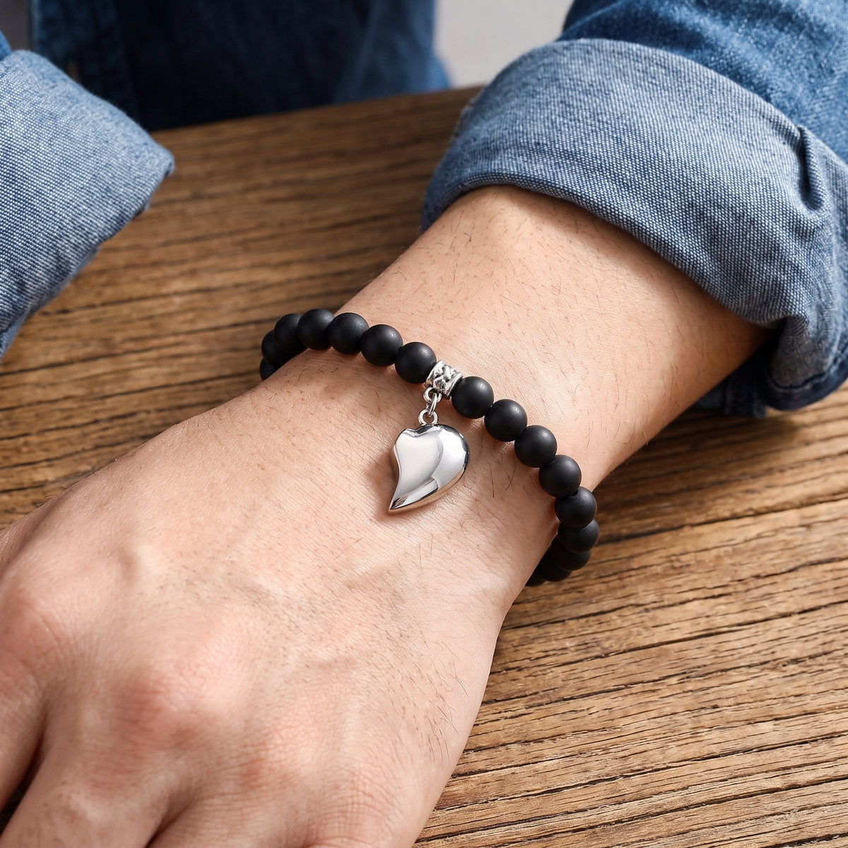 Black lava Magnetic Hearts bracelet worn by him